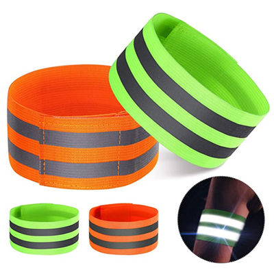 Eseguire il polso arancio del braccio delle cinghie di nastro del riflettore di sicurezza dell'ingranaggio dei bracciali riflettenti di sicurezza