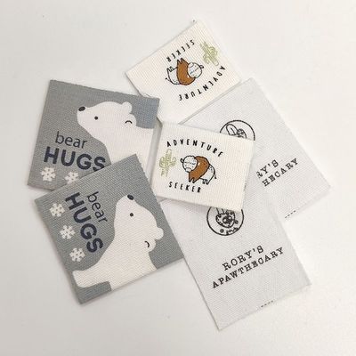 Il nastro ricamato su ordinazione del cotone delle etichette del bambino dell'abbigliamento di nome ha stampato Logo Labels tessuto su ordinazione
